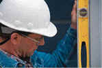 Field observation being conducted with a hard hat and level